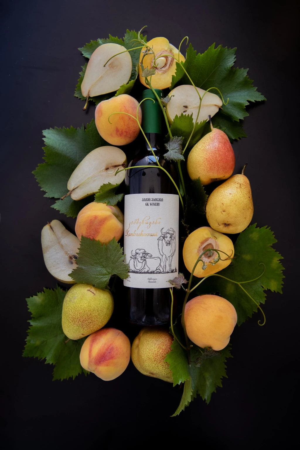 GK Winery bottle arranged with pears and peaches